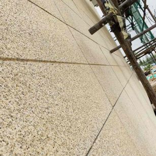 绥化 黄金麻花岗岩荔枝面外墙干挂石材效果示例